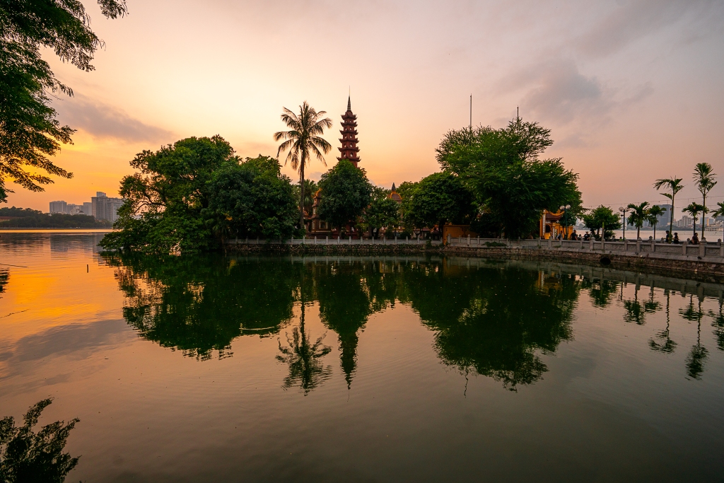 Pagoda at sunset reflection in Hanoi, Vietnam 